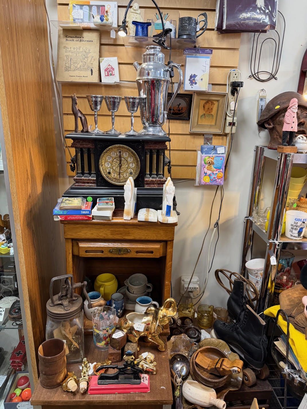 A booth of clocks, cameras and glassware.