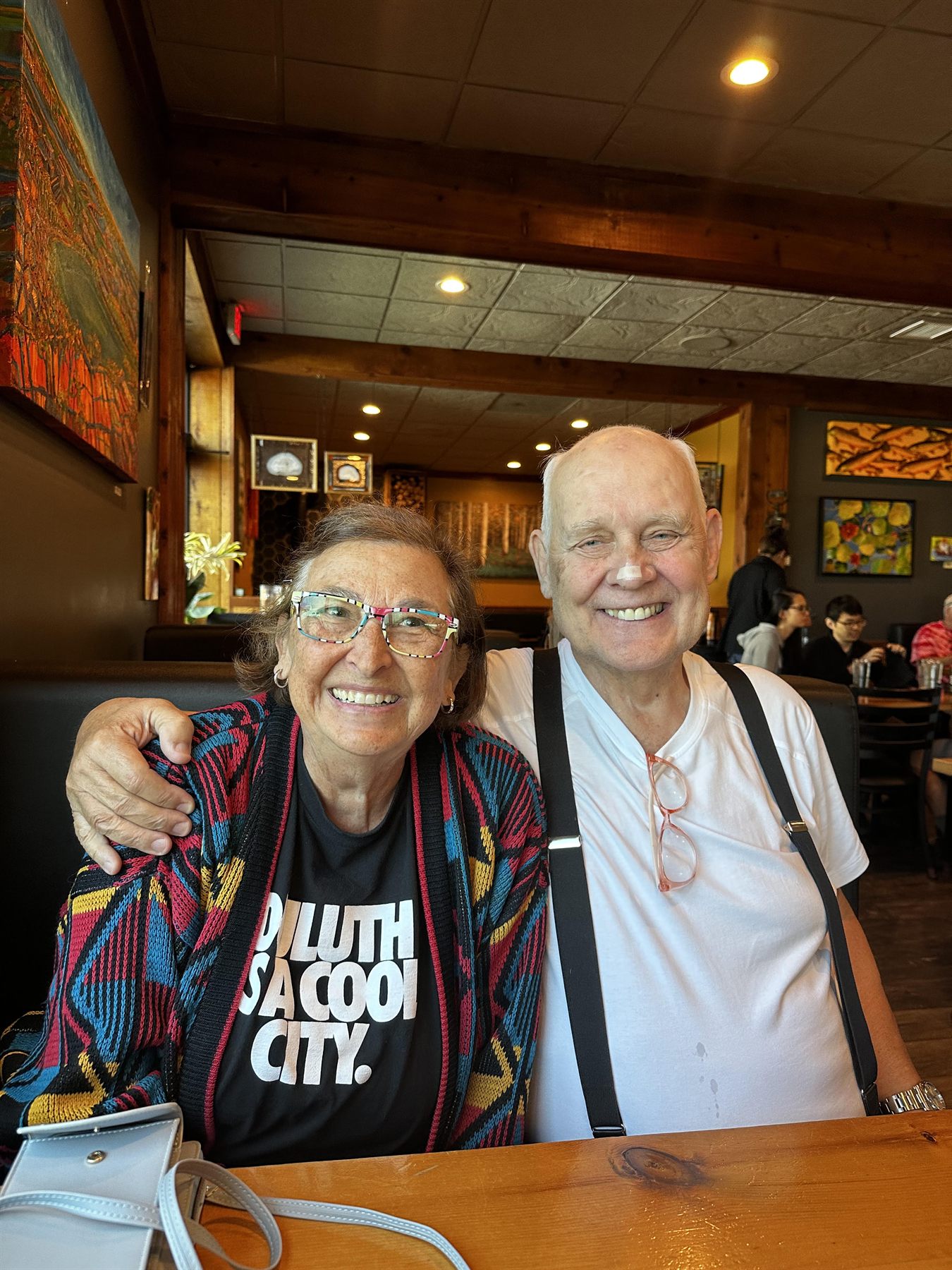 Carol and Dave Jouppi together at a Duluth cafe, smiling.